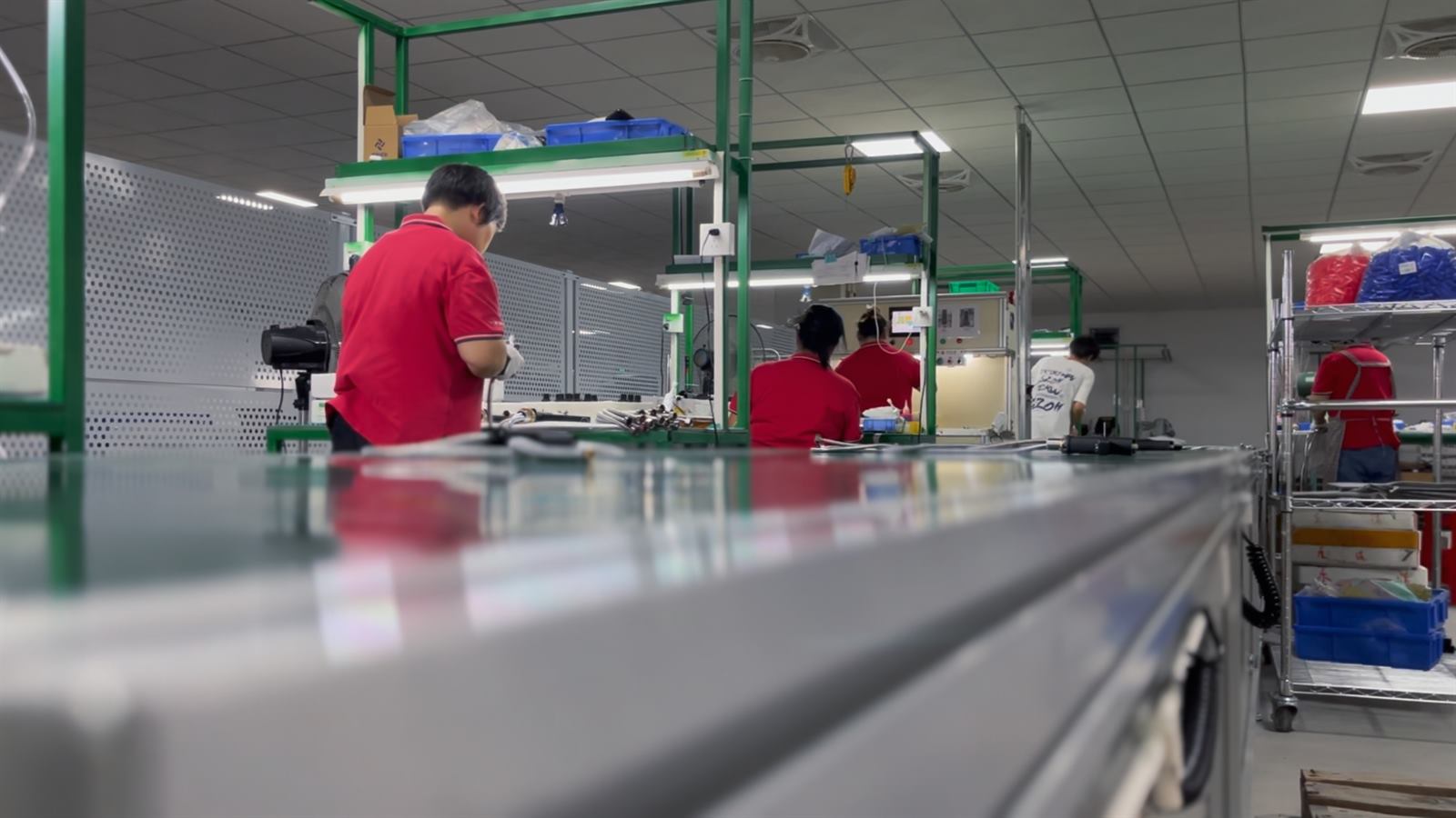 Operators working on the faucet production line